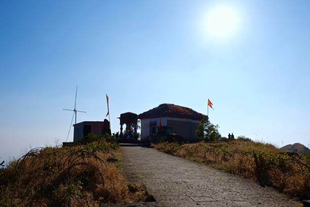 Purandar fort landscape scene in winter season Dry meadows and blue cloudy sky, Pune, Maharashtra, India village maharashtra stock pictures, royalty-free photos & images