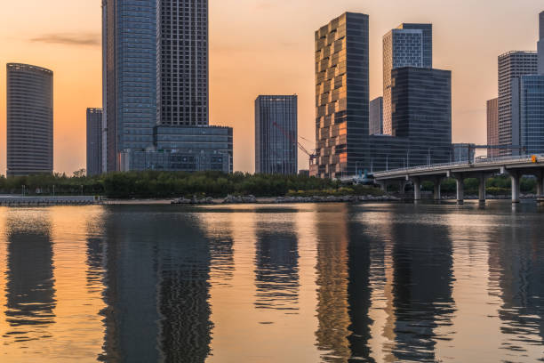 istock Modern buildings near water at sunrise 1093526634