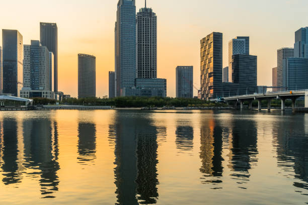 istock Modern buildings near water at sunrise 1093526912