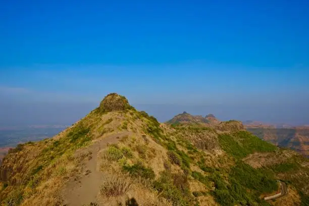 Dry meadows and blue cloudy sky, Pune, Maharashtra, India