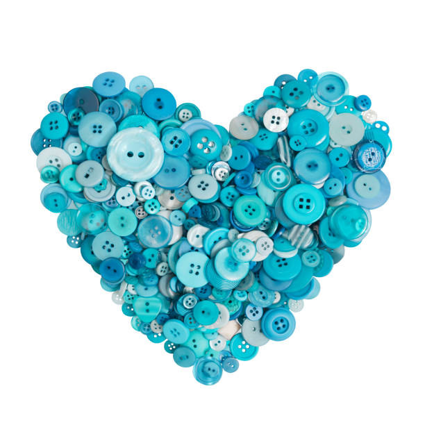 istock turquoise heart of many buttons. 1093528482