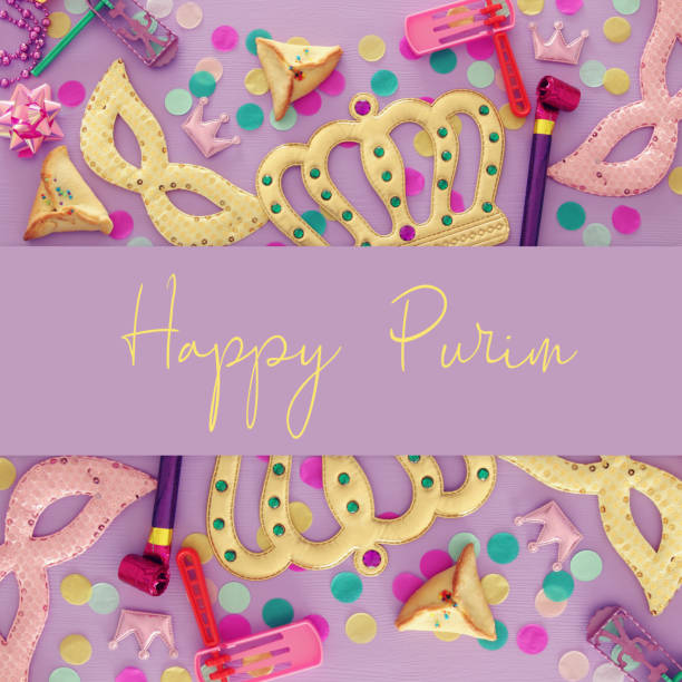 istock Purim celebration concept (jewish carnival holiday) over wooden pink background 1093529072