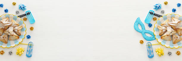 istock Purim celebration concept (jewish carnival holiday) over wooden white background. 1093529104