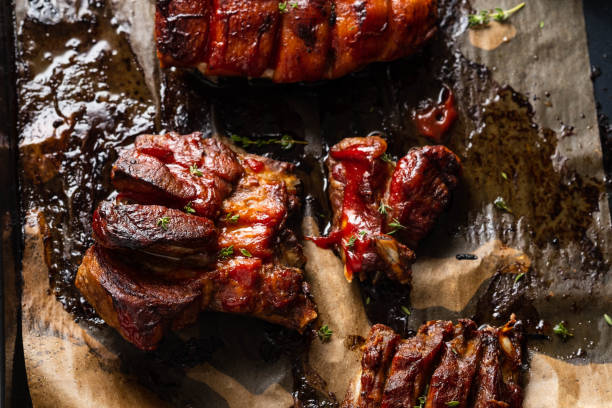 istock Grilled pork ribs on baking paper, top view. Copy space. 1093529644