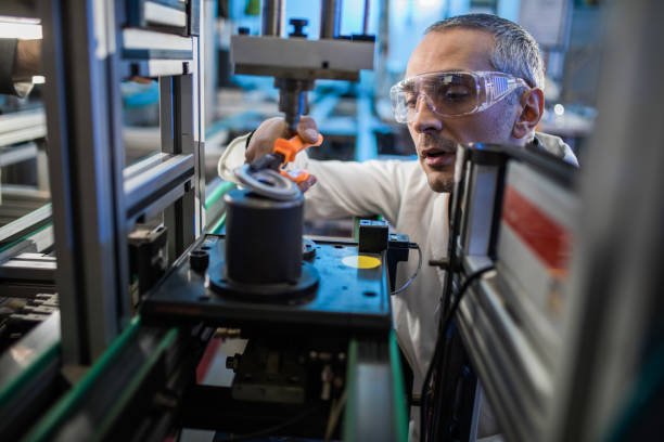 istock Focused mid adult engineer working on machinery in laboratory. 1093529914