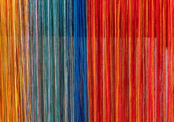 Colored threads of an ancient wooden loom Colored threads of an ancient wooden loom . loom photos stock pictures, royalty-free photos & images