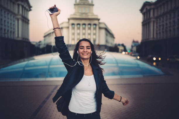 istock Young woman dancing on music 1093535098