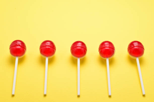 istock Lollipop on a yellow background. Space for text or design. 1093537562