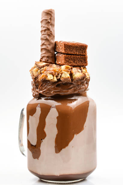 istock Chocolate extreme milkshake with brownie cake, chocolate paste and sweets. Crazy freakshake food trend. Copy space 1093537642