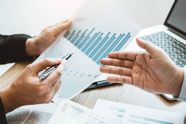 istock Co-working Business Team meeting Planning Strategy Analysis investment and saving concept. meeting discussing new plan financial graph data on Laptop. 1093540866