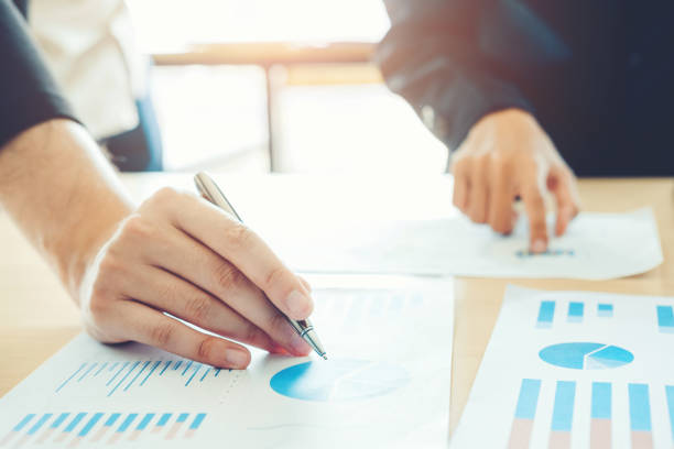 istock Co-working Business Team meeting Planning Strategy Analysis investment and saving concept. meeting discussing new plan financial graph data 1093540944