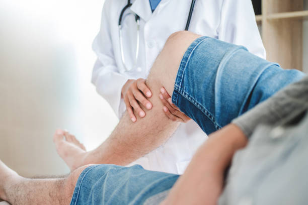 istock Doctor consulting with patient Knee problems Physical therapy concept 1093541046