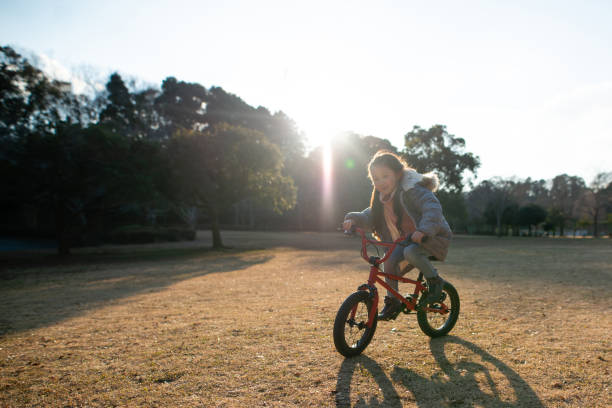 istock Girl playing with bicycle 1093543414
