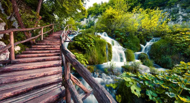 Fantastic morning view of Plitvice National Park. Colorful spring scene of green forest with pure water waterfall. Beautiful countryside landscape of Croatia, Europe. Traveling concept background.