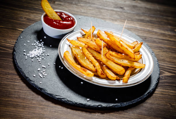 istock French fries on wooden background 1093548696