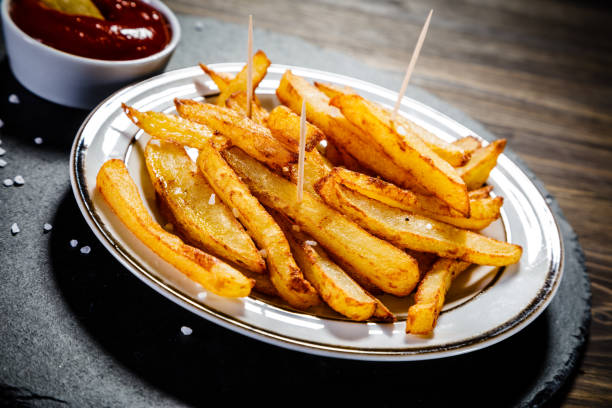 istock French fries on wooden background 1093548936