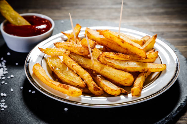 istock French fries on wooden background 1093549126