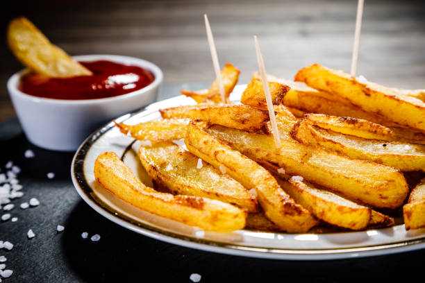 istock French fries on wooden background 1093550424