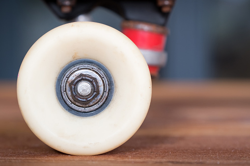 A close up of a skateboard wheel and a used bearing