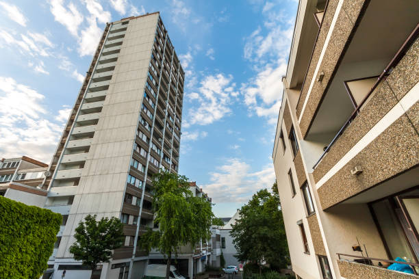 istock High multistoried apartment building with trees against blue sky. 1093551676