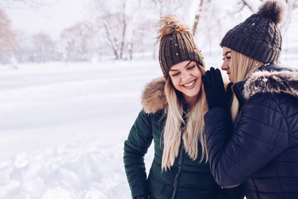 istock Girlfriends in the park on sunny winter day. 1093558486