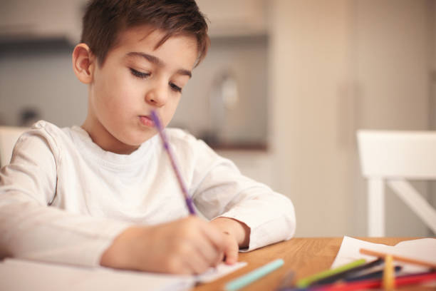istock Family at home doing homework together 1093558820
