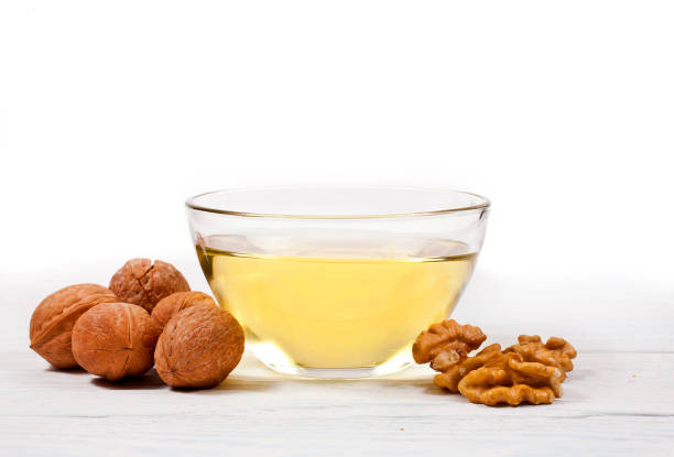 istock Walnuts heap and walnuts oil 1093558922