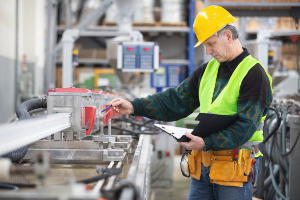 istock Senior worker in the factory operating machines 1093561310