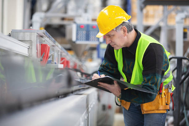 istock Senior worker in the factory operating machines 1093561478