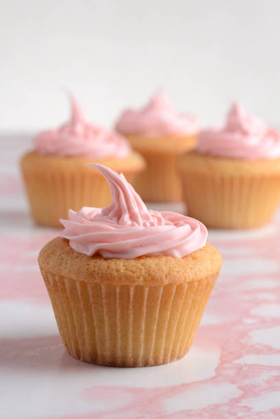 istock vanilla cupcake with pink frosting 1093578178