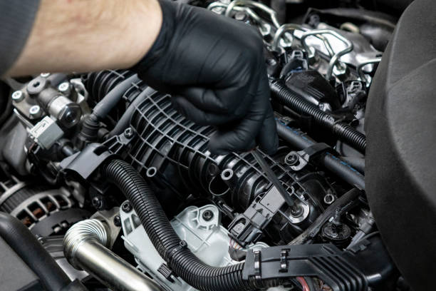 istock Auto mechanic working in garage. Repair service. 1093579504