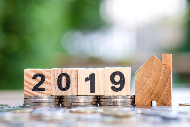 istock House model and 2019 block number on stack coins. 1093580626