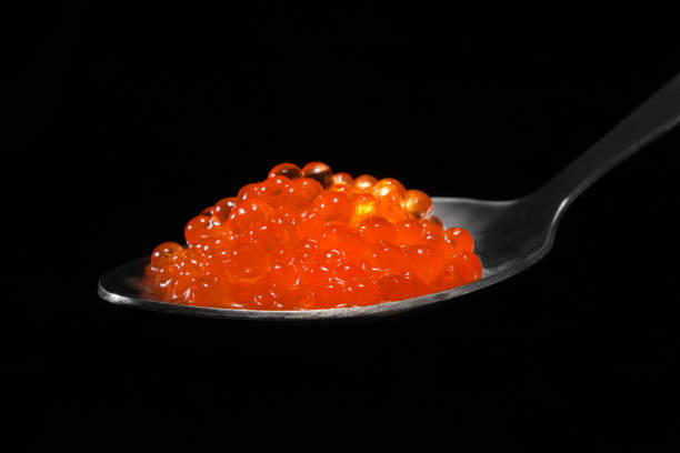 istock Red caviar in a spoon close-up. 1093581894