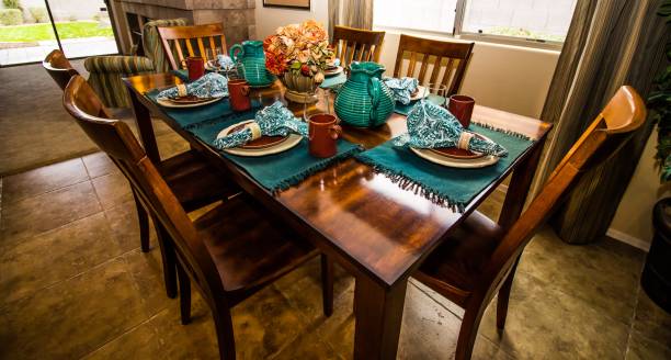 istock Wooden Table And Chairs With Centerpiece And Place Settings 1093583272