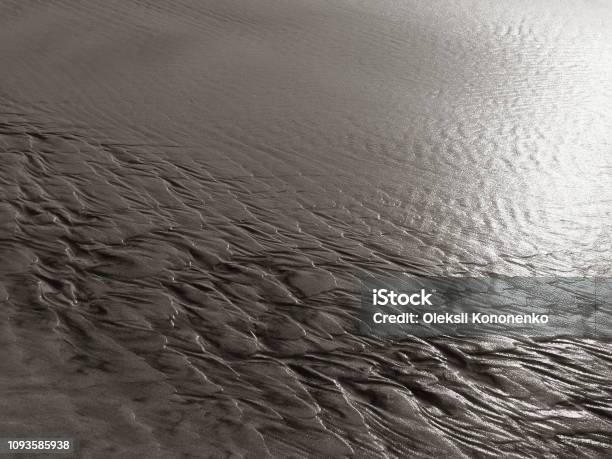 Patterns Created N The Sand By Waves And Wind Sand Pattern As Background Stock Photo - Download Image Now