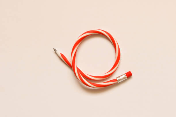 istock Red and white flexible pencil on white background. 1093587986