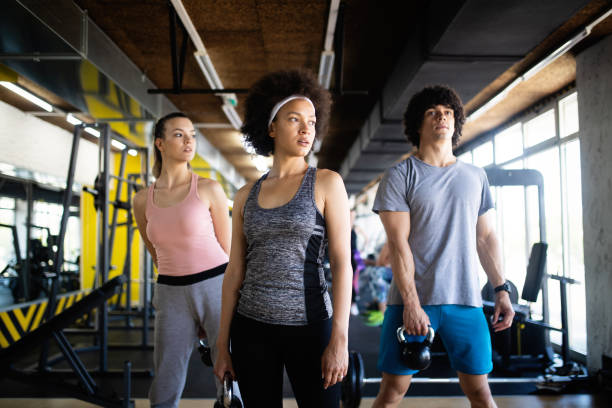 istock Healthy young athletes doing exercises at fitness studio. 1093588228