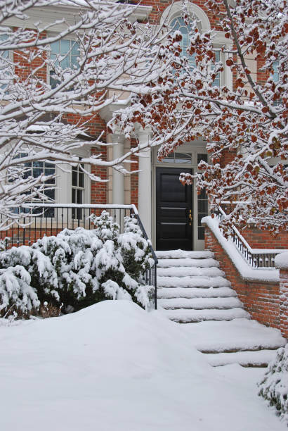 istock snow covered front steps of a house 1093590976