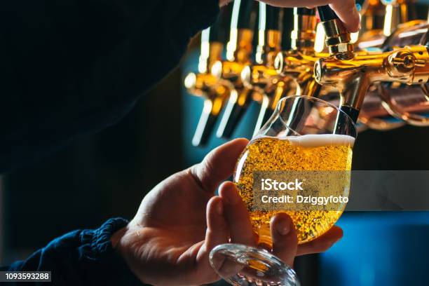 Close Up Of Bartender Pouring Draft Beer In Glass Stock Photo - Download Image Now - Beer - Alcohol, Brewery, Beer Tap