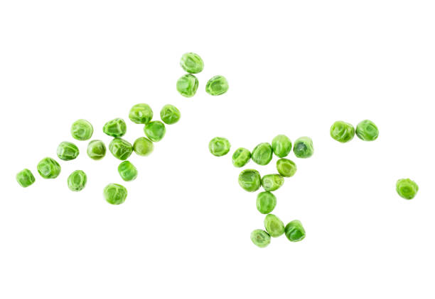 istock Green peas isolated on white background, top view. 1093593546