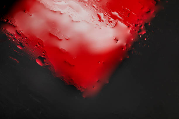 This macro and abstract photo is created by placing color objects outside the focus of the camera lens.The water or oil is on a glass material.