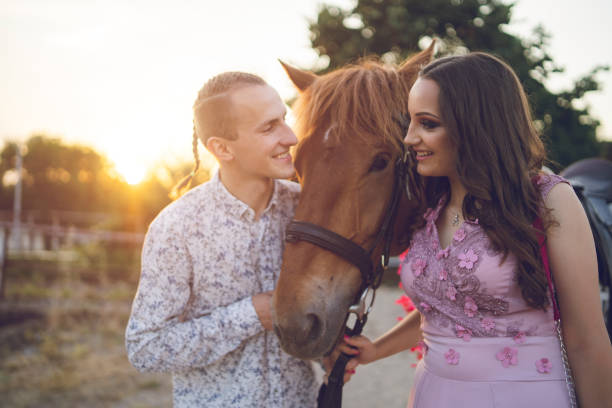 istock Young couple with their pet horse 1093597032