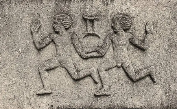 Zodiac - Gemini or Twins, a stone relief on ancient wall