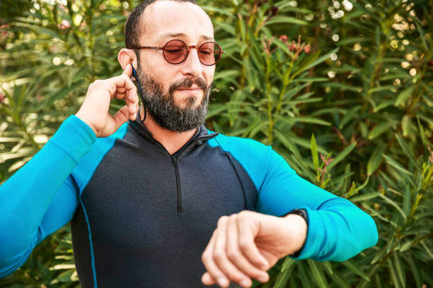 istock Mid Adult Man Checking Smart Watch During Sport Activity 1093602400