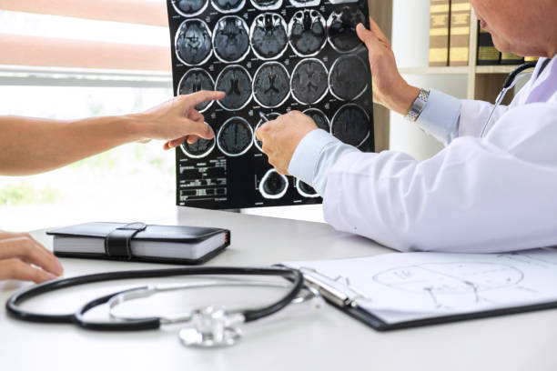 istock Professor Doctor having conversation with patient and holding x-ray film while discussing explaining symptoms or counsel diagnosis health, healthcare and assistance concept 1093605464