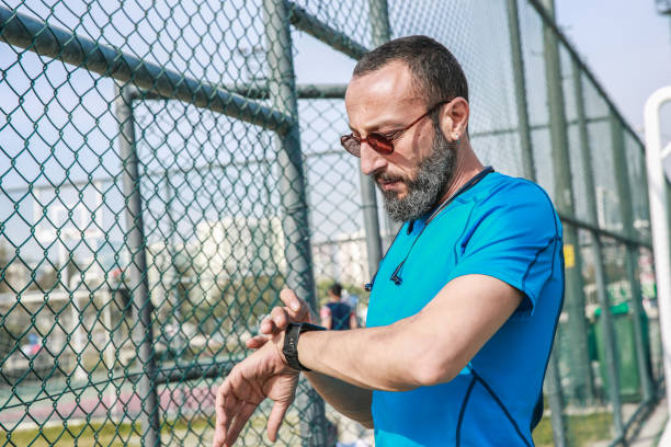 istock Mid Adult Man Checking Smart Watch During Sport Activity 1093605656
