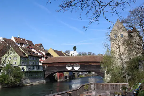 Swiss old town Baden on the river Limat with the traditional covered wooden bridge