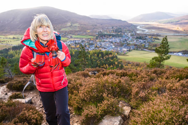 istock Female hiker on trail above Braemar, Scotland 1093606156