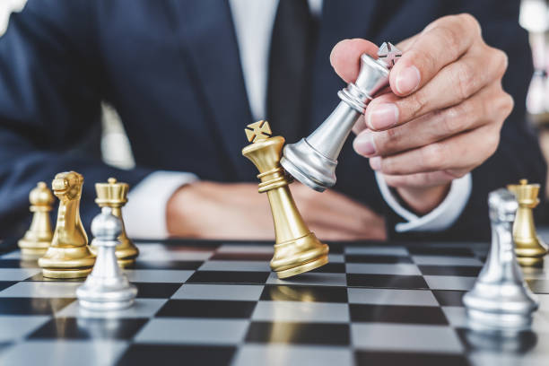 istock Businessman playing chess game reaching to plan strategy for success, thinking for planning overcoming difficulty and achieving goals business strategy for win, management or leadership concept 1093610226