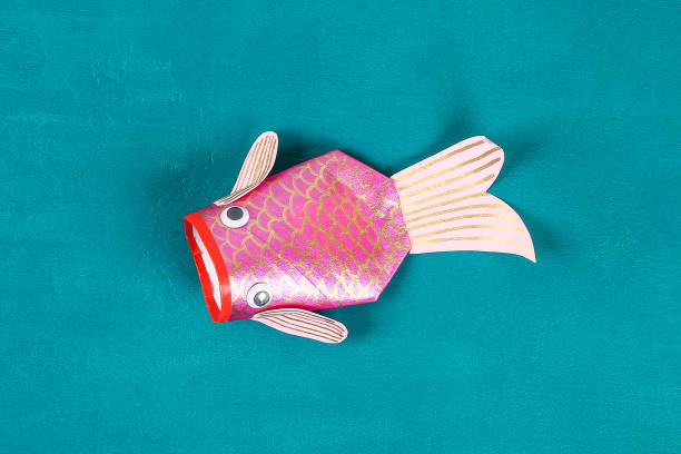 Diy koi carp fish on blue green background.